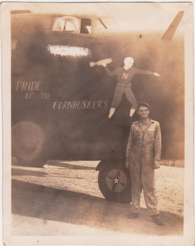 A crewman standing beside the B-24 &ldquo;Pride of the Cornhuskers&rdquo;